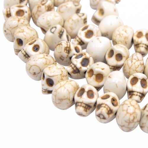 Perles crâne skull ivoire 13 mm en magnésite synthétique. Idéales pour bracelets, bijoux gothiques et créations Halloween. Lots de 10 ou 20.