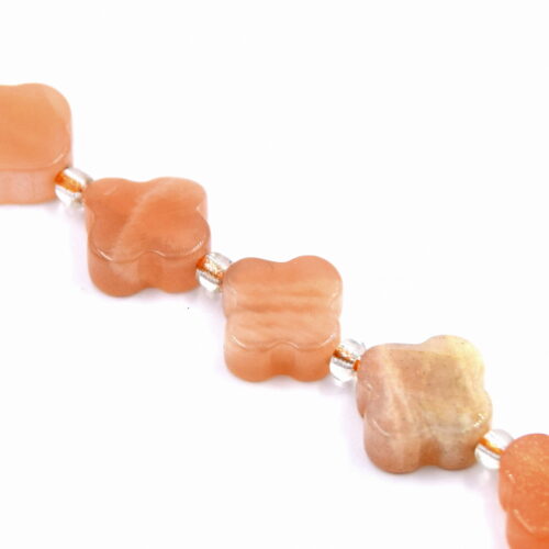 perles de soleil naturelle forme trèfle scintillante pour création de bijoux.